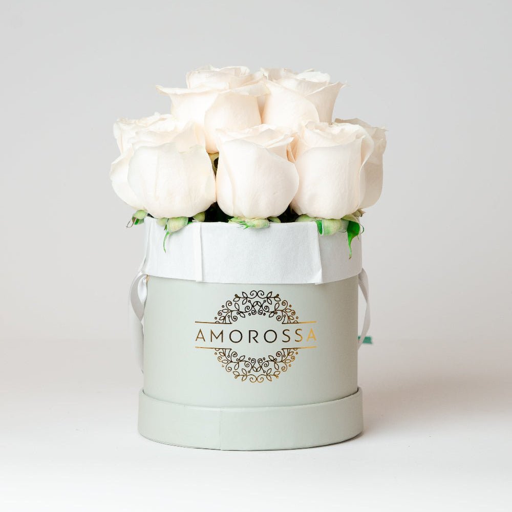 AMOROSSA - LAVAN 12 - Elegant white roses arranged in a gray box, perfect for regalar flores and mandar rosas with delivery rapido de flores from.