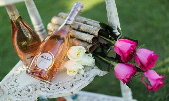 AMOROSSA - MASCHIO ROSÉ -  750 ml. - 750ml Maschio Rosé bottle with pink label, surrounded by strawberries and purple flowers, perfect for regalar flores and.